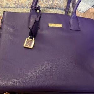 Joy & Iman purple bag with watch accessory